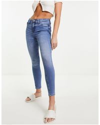River Island - Jeans skinny a vita medio alta, colore medio slavato - Lyst