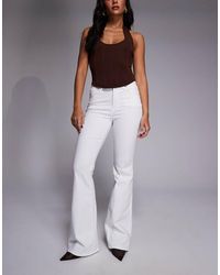 GOOD AMERICAN - High Rise Good Legs Flare Jean - Lyst