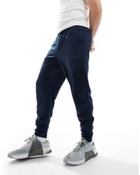 Nike - – totality dri-fit – schmal zulaufende jogginghose - Lyst