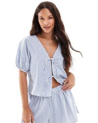 The Frolic - Top De Pijama A Rayas Blancas Y Azules Con Mangas Abullonadas Y Lazadas Delanteras Exclusivo De (Parte De Un Conjunto) - Lyst