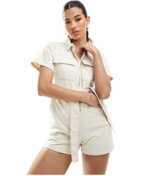 In The Style - Utility Zip Through Belted Playsuit - Lyst