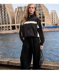 Stradivarius - Petite Sarouel Trousers With Buckle - Lyst