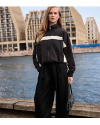 Stradivarius - Petite Sarouel Trousers With Buckle - Lyst