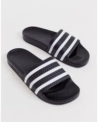 adidas Originals Sandals and flip-flops for Men - Up to 60% off | Lyst
