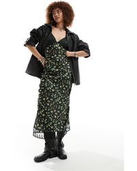 Reclaimed (vintage) - Vestido lencero negro con estampado floral e insertos - Lyst