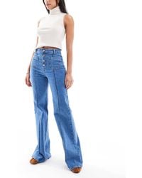 Miss Selfridge - – schlagjeans aus denim im stil der 70er mit aufgesetzten taschen - Lyst