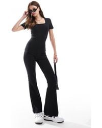 ASOS - Tuta Jumpsuit A Zampa Nera A Coste Con Maniche Corte E Scollo Squadrato - Lyst