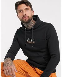 tuta kenzo lucida nera e oro