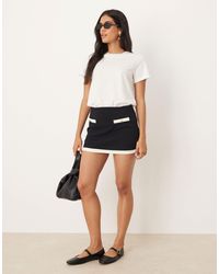 Mango - Mini-jupe d'ensemble en coton avec détail contrastant - et blanc - Lyst