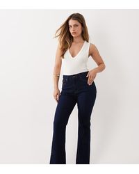 GOOD AMERICAN - Petite Good Legs Flare Jeans - Lyst