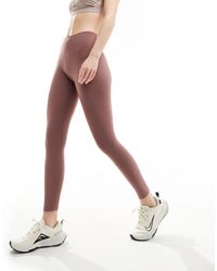 Nike - Nike - one training dri-fit - leggings alla caviglia a vita medio alta malva fumé - Lyst