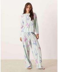 ASOS - Pigiama Blu A Righe Con Stampa Di Fiocchi Composto Da Pantaloni E Top A Maniche Lunghe - Lyst