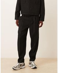 ASOS - Pantalon habillé d'ensemble coupe oversize fuselée avec taille partiellement élastique - Lyst