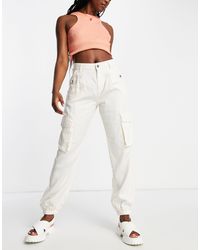 Miss Selfridge - Pantalones cargo color holgados con bajos elásticos - Lyst