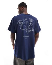 ASOS - Camiseta azul extragrande con estampado floral en la espalda - Lyst