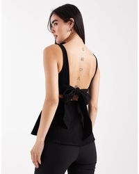 ASOS - Denim Peplum Top With Bow Back Detail - Lyst