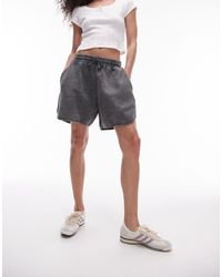 TOPSHOP - Pantaloncini da jogging corti neri lavaggio acido - Lyst