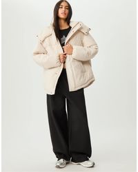 Stradivarius - Doudoune oversize à capuche - écru - Lyst