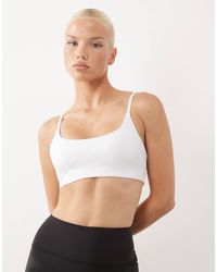 4505 - Icon Scoop Neck Light Support Sports Bra With Adjustable Straps - Lyst