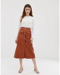 ASOS Gonna midi in pelle sintetica con tasche vistose e bottoni a pressione sul davanti - Marrone