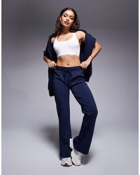 ASOS - Asos design petite – ausgestellte jogginghose aus interlock-stoff - Lyst