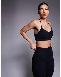 4505 - Seamless Baby Rib Light Support Sports Bra - Lyst
