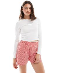Levi's - Camiseta Blanca De Estilo Deportivo De Manga Larga Con Logo De Murciélago De Lunares Brillantes De - Lyst