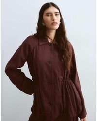 ARRANGE - Button Down Cinch Waist Peplum Blazer - Lyst