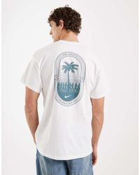 Nike - T-Shirt Bianca Con Stampa Di Palme Sul Retro - Lyst
