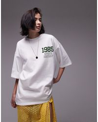 TOPSHOP - T-shirt bianca oversize con grafica "1985 sports district" - Lyst