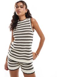 Vero Moda - – ärmelloses, gestreiftes longline-oberteil aus häkelstoff - Lyst