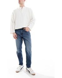 ASOS - Jeans Met Smaltoelopende Pijpen - Lyst
