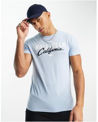 Hollister - T-shirt tecnica azzurra con logo - Lyst