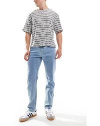 ASOS - Vaqueros Elásticos Con Lavado Claro De Corte Slim De -Azul - Lyst