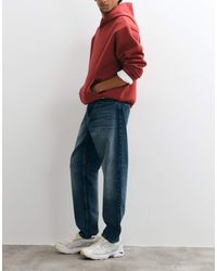 Carhartt - Newel Relaxed Tapered Fit Jeans - Lyst