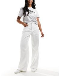 Abercrombie & Fitch - Jeans a fondo ampio e vita alta bianchi - Lyst