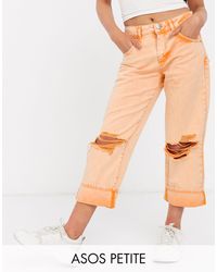 ASOS ASOS DESIGN Petite - Jeans a vita bassa arancioni con strappi estremi - Arancione