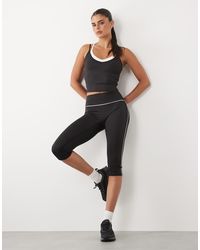 4505 - Active Low Rise Capri legging With Piping Detail - Lyst
