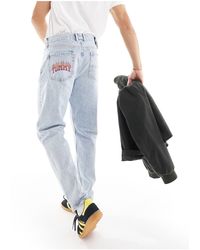 Tommy Hilfiger - Isaac - jeans affusolati comodi lavaggio chiaro - Lyst
