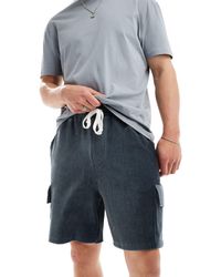 ASOS - Pantalones cortos grises extragrandes con bolsillos cargo - Lyst