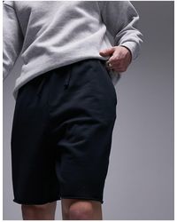 TOPMAN - Pantalones cortos extragrandes con lavado y bajos sin rematar - Lyst
