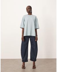 ARRANGE - Tova Tapered Curved Leg Jeans With Roll Hem - Lyst
