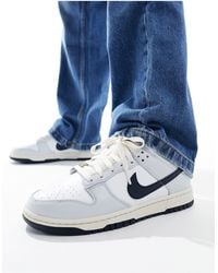 Nike - Dunk low nn - sneakers bianche, grigie e nere - Lyst