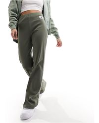 Calvin Klein - Pantaloni dritti oliva con logo - Lyst