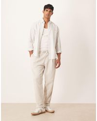 ASOS - Relaxed Tapered Trackies With Pleats - Lyst