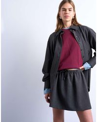 TOPSHOP - Minifalda Muy Corta De Talle Bajo Con Vuelo Y Raya Diplomática De Tejido Cepillado De - Lyst