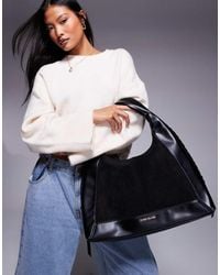 River Island Black Oversized Ring Front Slouch Bag Lyst UK