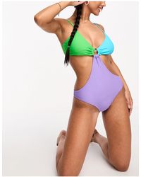 Pieces - – badeanzug mit pastellfarben im farbblockdesign, zierausschnitte - Lyst