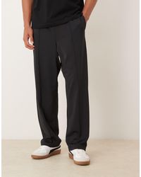 ASOS - Ruimvallende Toelopende Joggingbroek Van Scuba-Achtige Stof Met Plooitjes - Lyst