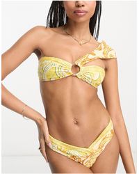 River Island - Top bikini a fascia con nodo con stampa - Lyst